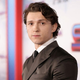 Tom Holland wears a suit at the premiere of Spider-Man: No Way Home.